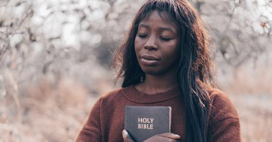 Woman holds Bible
